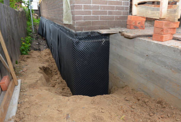 Happy homeowners after waterproofing job in Harpersville